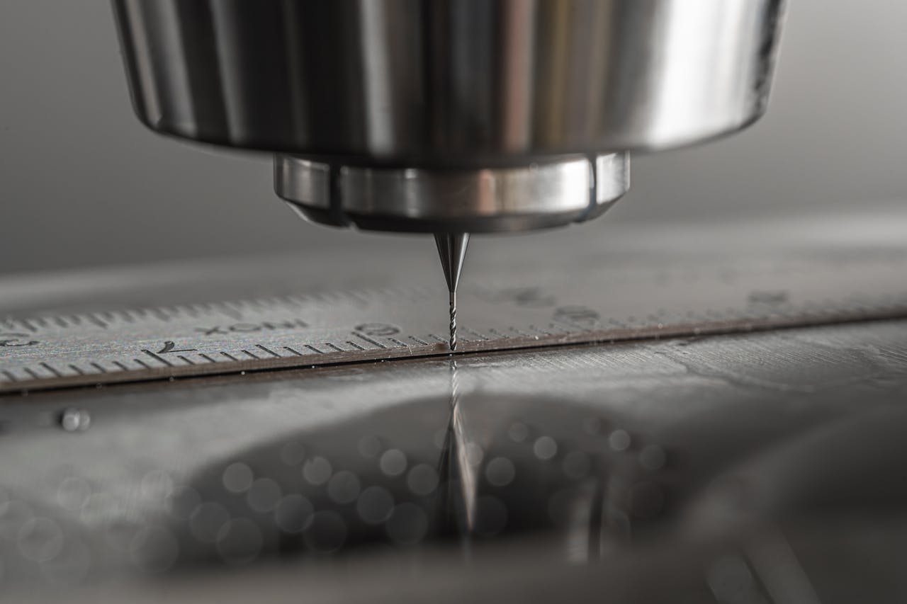 Detailed close-up of a CNC milling machine working on metal, showcasing precision and industry technology.