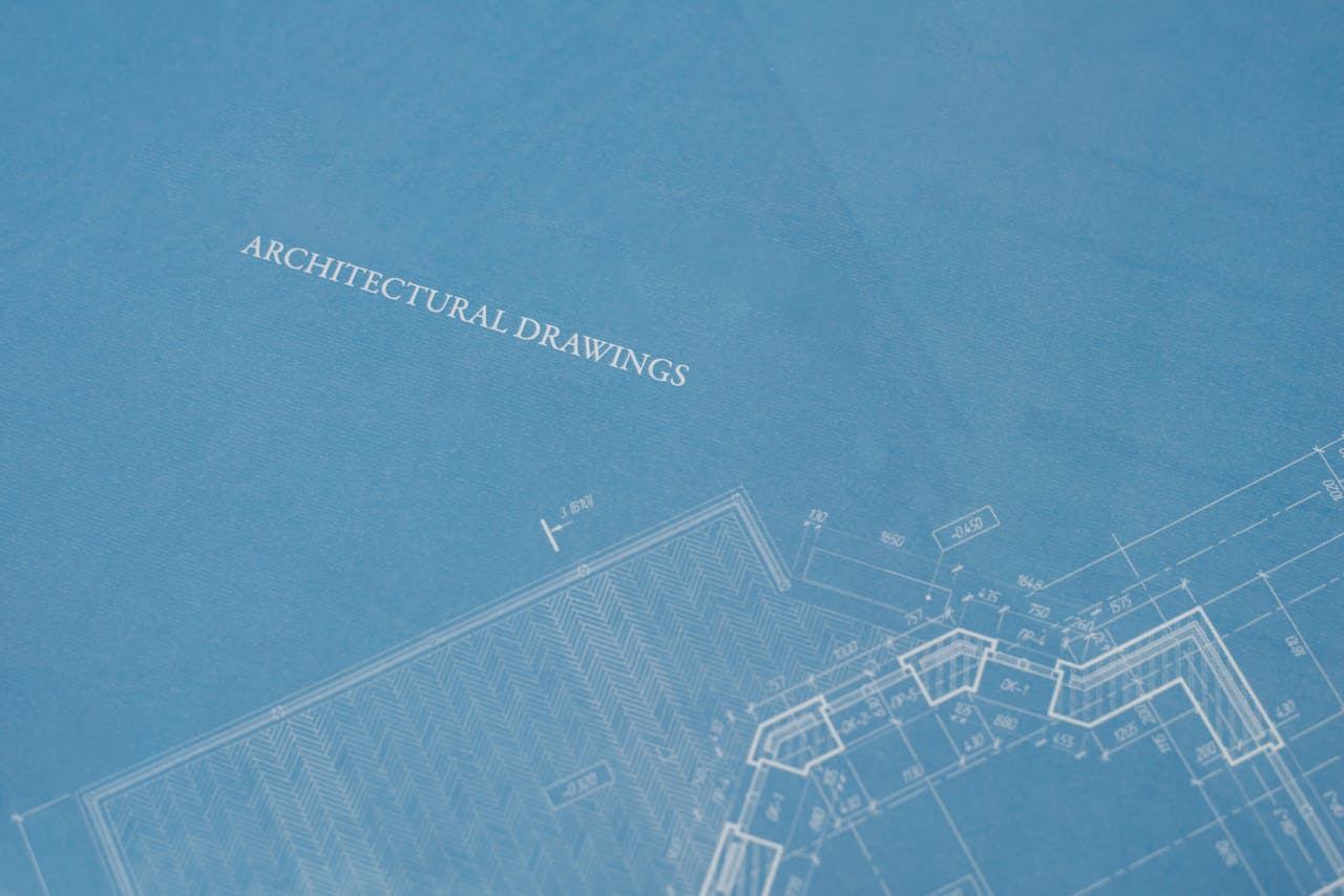 Close-up view of architectural blueprint with technical drawings.